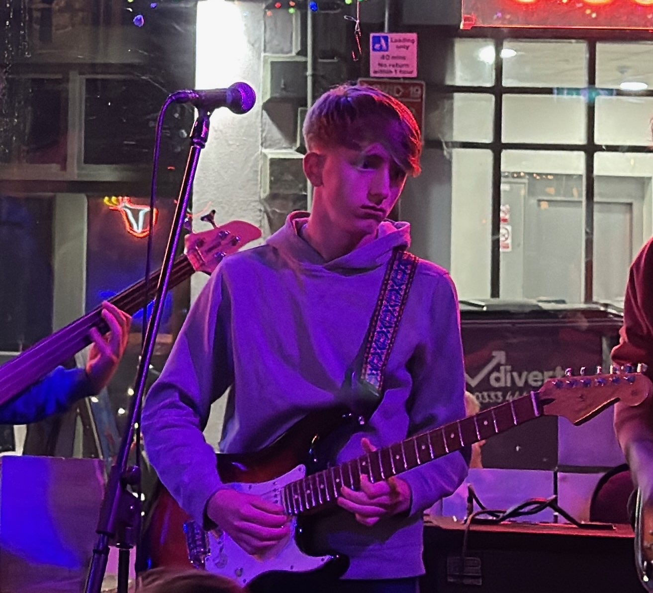 Luca Fewtrell playing guitar